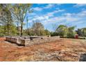 This image showcases a solid foundation ready for a new home, set against a blue sky, symbolizing stability and potential at 5005 County Home Rd, Conover, NC 28613