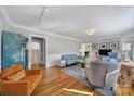 Stylish living room with hardwood floors, modern furniture and ample natural light at 6823 City View Dr, Charlotte, NC 28212