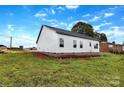Exterior view of a home, showing its siding, foundation, and surrounding lawn, ready for landscaping at 8455 W Nc 152 Hwy, Mooresville, NC 28115