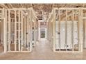 Interior framing and utilities installation, with visible doorway and a partial view to the yard at 8455 W Nc 152 Hwy, Mooresville, NC 28115