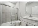 Spotless bathroom with a glass-enclosed shower, white vanity, and modern fixtures at 9940 Manor Vista Trl, Kannapolis, NC 28027