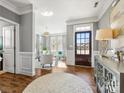 Beautiful foyer with wood floors, detailed trim, natural light, and an open view into the living area at 1022 Doughton Ln, Indian Trail, NC 28079