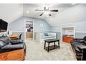 Cozy bonus room with comfortable seating, desk, and a playful game nook for relaxation and entertainment at 1625 Saint Paul Church Rd, Salisbury, NC 28146