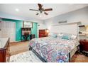 Spacious main bedroom featuring soft carpet, fan, decor, and colorful bedding for a cozy retreat at 1625 Saint Paul Church Rd, Salisbury, NC 28146