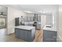 Open kitchen with a center island, stainless steel appliances, and stylish countertops at 1641 Knoll Dr, Vale, NC 28168