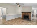 Cozy living room with a classic brick fireplace and neutral decor at 1641 Knoll Dr, Vale, NC 28168