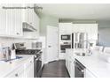 Well-lit kitchen featuring stainless steel appliances, granite countertops, and ample cabinet space at 2009 Nettle Bank Rd # 3292, Indian Trail, NC 28079