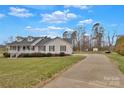 Property featuring a long drive and large lawn at 207 Silver Creek Ln, Shelby, NC 28152