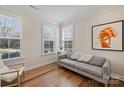 Bright sitting room with hardwood floors, natural light, and comfortable seating at 208 Emerson Ave, Charlotte, NC 28204