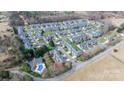 Expansive aerial view of a well-planned community featuring numerous homes and a community pool at 3131 9Th Street Ne Dr # 31, Hickory, NC 28601