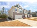 Attractive two-story townhome features a two car garage and neutral color palette at 336 Abington St, Matthews, NC 28104
