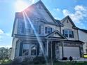 Two-story home featuring stone accents, a two car garage and landscaping at 4253 Stream Dale Nw Cir, Concord, NC 28027
