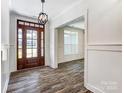 A bright foyer boasts of wood floors and paneled walls at 4262 Brandy Creek Ct, Clover, SC 29710
