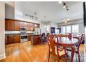 Open concept kitchen featuring an island, stainless steel appliances and hardwood floors at 4620 Piedmont Row Dr, Charlotte, NC 28210