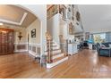 Expansive foyer with hardwood floors, staircase, decorative accents, and an inviting atmosphere at 4858 Sagittarius Cir, Denver, NC 28037