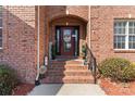 Charming front porch features decorative accents, an arched brickway, and an inviting entrance at 4858 Sagittarius Cir, Denver, NC 28037