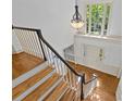 Elegant two-story foyer features hardwood floors, grand staircase, and a bright, open atmosphere at 5114 Morrowick Rd, Charlotte, NC 28226