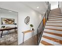Bright entryway showcasing a staircase with iron railings and an adjacent office space at 914 Greenleaf Ave # A, Charlotte, NC 28202
