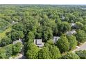 An aerial view of a home surrounded by lush greenery and trees at 9423 Fairmead Dr, Charlotte, NC 28269