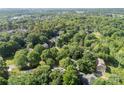 Expansive green tree canopy blankets the residential area, with houses interspersed within a dense and leafy neighborhood at 9423 Fairmead Dr, Charlotte, NC 28269