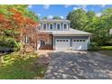 Charming two-story home with a well-manicured lawn and a two-car garage at 9423 Fairmead Dr, Charlotte, NC 28269