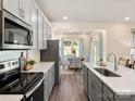 Modern kitchen featuring white countertops, stainless steel appliances, and gray cabinets at 1305 31St Ne St, Conover, NC 28613