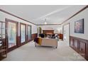 Spacious living room featuring a fireplace, neutral decor, and ample seating, creating a cozy atmosphere at 1624 Chadmore Nw Ln, Concord, NC 28027
