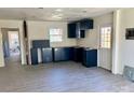 Kitchen area featuring newly installed dark blue cabinets and an open layout, ready for appliances at 2546 Amber Crest Dr, Gastonia, NC 28052