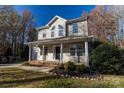 Attractive two-story home with inviting front porch and well-maintained landscaping at 617 Edinburgh Ct, Rock Hill, SC 29730