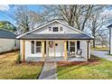 Inviting front porch with stylish seating, perfect for relaxing and enjoying the outdoors at 691 Gibson Nw Dr, Concord, NC 28025