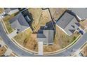 Aerial view of a home with a fenced backyard and circular driveway at 7436 Meridale Forest Dr, Charlotte, NC 28269