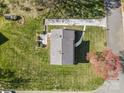 Aerial view of the property showing its layout, long driveway, landscaping, and surrounding greenery at 9218 Robert Burns Ct, Charlotte, NC 28213