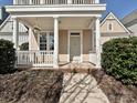 Inviting front porch with classic white columns and manicured landscaping at 10133 Caldwell Forest Rd, Charlotte, NC 28213