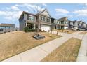 Suburban home with a two-car garage, lawn, and charming curb appeal at 123 Clauser N Rd, Mount Holly, NC 28120