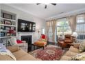 Cozy living room with a fireplace, built-in shelves, and ample natural light from the sliding glass doors at 138 Margo Ln, Statesville, NC 28677