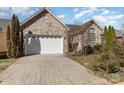 Exterior of home showcasing brick facade, two-car garage, and paved driveway at 151 Birkdale Dr, Salisbury, NC 28144