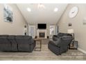 Bright living room featuring fireplace, TV, and neutral tones throughout at 151 Birkdale Dr, Salisbury, NC 28144