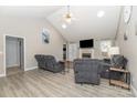 Spacious living room with vaulted ceilings, fireplace, and wood-look flooring at 151 Birkdale Dr, Salisbury, NC 28144