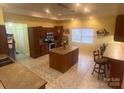 Well-appointed kitchen with an island, stainless steel appliances, and ample counter space at 1514 Ring Tail Rd, Claremont, NC 28610