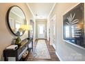 Warm foyer with wood floors, a console table with décor, and neutral paint color scheme at 1766 Loggerhead Dr, Lancaster, SC 29720
