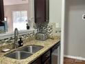 Kitchen with stainless steel appliances, granite countertops, mosaic backsplash, and a stainless sink at 218 Cottonwood Park Dr, Charlotte, NC 28214