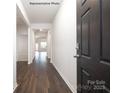Inviting entryway with dark wood floors and a view into the open floor plan of the home at 2315 Riggs Rd, Sherrills Ford, NC 28673
