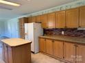 Well-lit kitchen with wood cabinets and a center island at 25387 Frick Rd, Richfield, NC 28137