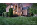 Beautiful brick home with a well-maintained lawn and carefully trimmed shrubs at 3017 Chisholm Ct, Waxhaw, NC 28173