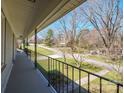 View from the balcony with black railings overlooking the front yard and neighborhood at 306 7Th Street Ne Pl, Conover, NC 28613