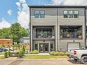 Back exterior view featuring private balconies, complemented by a well-maintained lawn at 403 Old Town Village Rd, Waxhaw, NC 28173