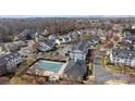 Aerial view of a community with a pool and clubhouse at 4627 Eaves Ln, Charlotte, NC 28215
