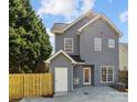 Backyard view showing the gray siding and wooden privacy fence at 4627 Eaves Ln, Charlotte, NC 28215