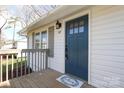 Close-up of the front entrance with a stylish blue door and well-maintained porch at 517 Roberts Ave, York, SC 29745