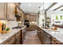 Gourmet kitchen featuring granite countertops, stainless steel appliances, and custom cabinetry at 6026 Gray Shadow Ct, York, SC 29745